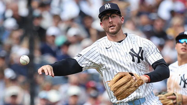 New York Yankees third baseman Ryan McMahon (19) makes a running throw to first base in the sixth inning against the Cincinnati Reds at Yankee Stadium.