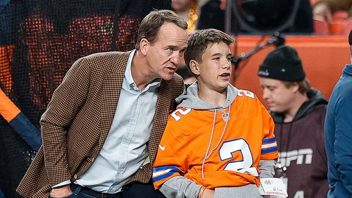 NFL legend Peyton Manning talks with his son Marshall prior to a 2024 NFL game in Denver. Friday, Marshall made his high school debut in a scrimmage featuring two nationally ranked high school teams. Manning and his Baylor (TN) visited Buford (GA). NFL legend Peyton Manning talks with his son Marshall prior to a 2024 NFL game in Denver. Friday, Marshall made his high school debut in a scrimmage featuring two nationally ranked high school teams. Manning and his Baylor (TN) visited Buford (GA).
