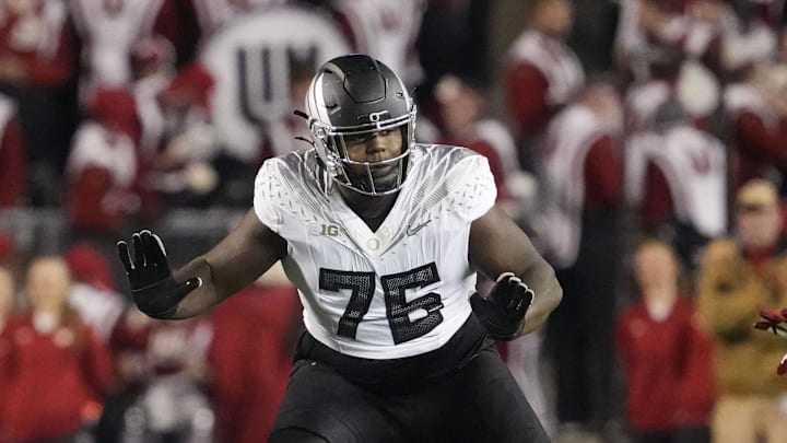Nov 16, 2024; Madison, Wisconsin, USA;  Oregon Ducks offensive linenam Josh Conerly Jr. (76) during the game against the Wisconsin Badgers at Camp Randall Stadium. Mandatory Credit: Jeff Hanisch-Imagn Images