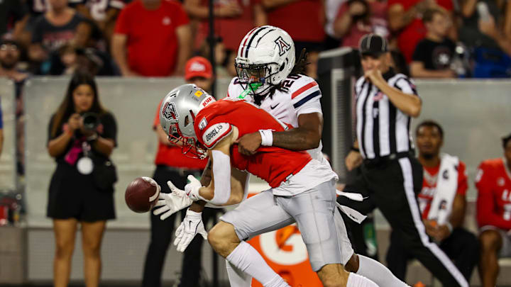 Aug 31, 2024; Tucson, Arizona, USA; Arizona Wildcats defensive back Marquis Groves-Killebrew (20) deflects catch from New Mexico Lobos wide receiver Nic Trujillo (7) during third quarter at Arizona Stadium. Mandatory Credit: Aryanna Frank-Imagn Images