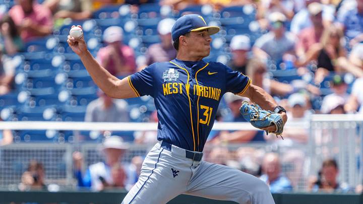 Jun 16, 2026; Omaha, NE, USA; West Virginia Mountaineers starting pitcher Dawson Montesa (31) pitches against the Troy Trojans during the first inning at Charles Schwab Field. Jun 16, 2026; Omaha, NE, USA; West Virginia Mountaineers starting pitcher Dawson Montesa (31) pitches against the Troy Trojans during the first inning at Charles Schwab Field.