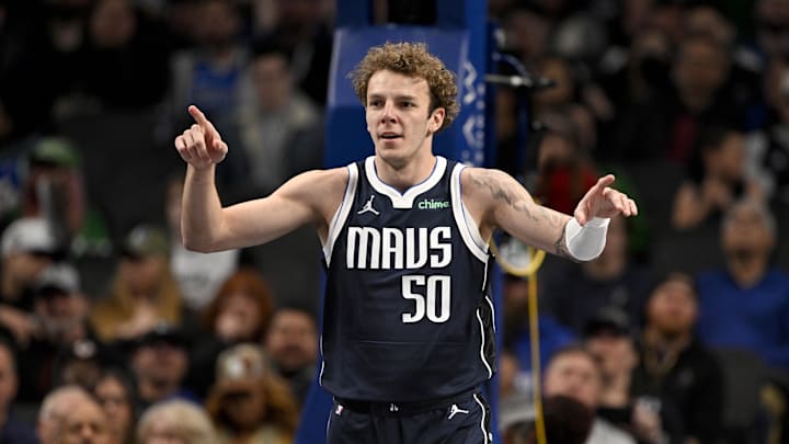 Jan 27, 2025; Dallas, Texas, USA; Dallas Mavericks center Kylor Kelley (50) points to his teammates after he is fouled during the second half against the Washington Wizards at the American Airlines Center. Mandatory Credit: Jerome Miron-Imagn Images