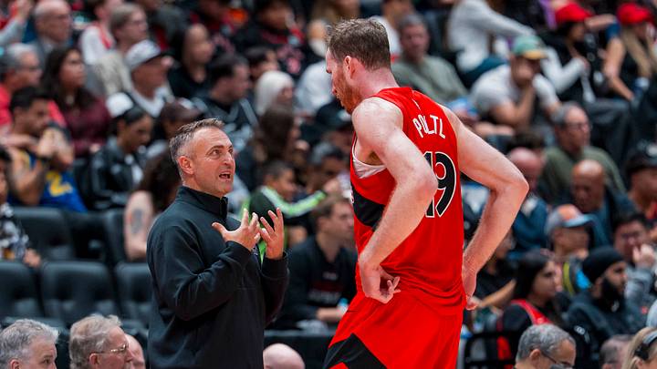 Oct 10, 2026; Vancouver, British Columbia, CAN; Toronto Raptors head coach Darko Rajakovic talks with center Jakob Poeltl (19) during a stop in play against the Los Angeles Clippers in the second half at Rogers Arena. Mandatory Credit: Bob Frid-Imagn Images Oct 10, 2026; Vancouver, British Columbia, CAN; Toronto Raptors head coach Darko Rajakovic talks with center Jakob Poeltl (19) during a stop in play against the Los Angeles Clippers in the second half at Rogers Arena. Mandatory Credit: Bob Frid-Imagn Images