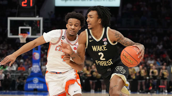 Mar 11, 2026; Charlotte, NC, USA; Wake Forest Demon Deacons forward Juke Harris (2) with the ball as Clemson Tigers guard Efrem Johnson (4) defends in the first half at Spectrum Center. Mandatory Credit: Bob Donnan-Imagn Images