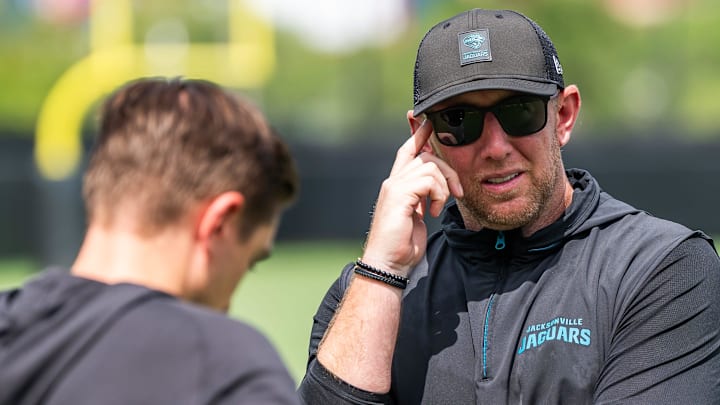 Jacksonville Jaguars general manager James Gladstone, left, talks with Jacksonville Jaguars head coach Liam Coen, right, after the. Jacksonville Jaguars’ mandatory minicamp Tuesday June 10, 2025 at the Miller Electric Center in Jacksonville, Fla. [Doug Engle/Florida Times-Union]