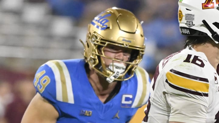 Oct 12, 2024; Pasadena, California, USA; Minnesota Golden Gophers quarterback Max Brosmer (16) scrambles out of the pocket against UCLA Bruins linebacker Carson Schwesinger (49) and defensive lineman Siale Taupaki (92) during the third quarter at Rose Bowl. Mandatory Credit: Robert Hanashiro-Imagn Images