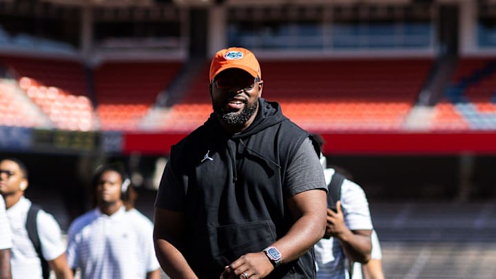 Florida Gators assistant coach for defensive line Gerald Chatman smiles with Florida Gators wide receiver Marcus Burke (88) during Gator Walk at the Orange and Blue spring football game at Steve Spurrier Field at Ben Hill Griffin Stadium in Gainesville, FL on Saturday, April 13, 2024. [Matt Pendleton/Gainesville Sun]