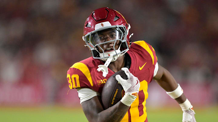 Sep 6, 2025; Los Angeles, California, USA; USC Trojans running back King Miller (30) carries the ball down the field for a touchdown in the second half against the Georgia Southern Eagles at the Los Angeles Memorial Coliseum. Mandatory Credit: Jayne Kamin-Oncea-Imagn Images