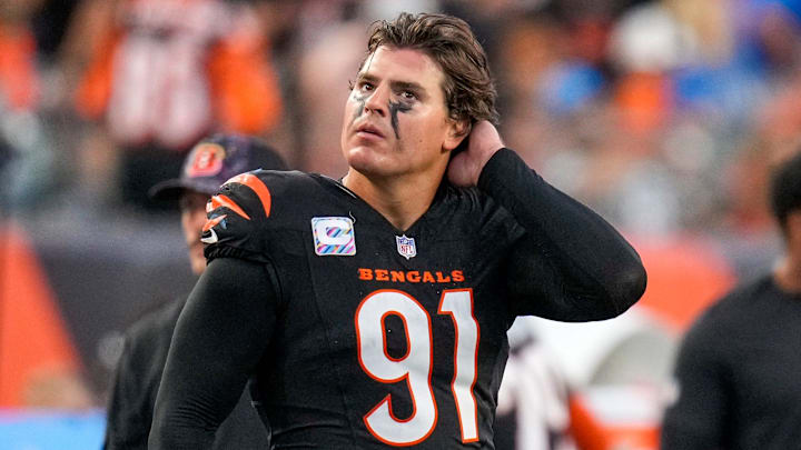 Cincinnati Bengals defensive end Trey Hendrickson (91) watches a replay as the Detroit Lions celebrate a touchdown in the fourth quarter of the NFL Week 5 game between the Cincinnati Bengals and the Detroit Lions at Paycor Stadium in downtown Cincinnati on Sunday, Oct. 5, 2025. The Bengals continued a losing streak, falling 37-24 to the Lions. Cincinnati Bengals defensive end Trey Hendrickson (91) watches a replay as the Detroit Lions celebrate a touchdown in the fourth quarter of the NFL Week 5 game between the Cincinnati Bengals and the Detroit Lions at Paycor Stadium in downtown Cincinnati on Sunday, Oct. 5, 2025. The Bengals continued a losing streak, falling 37-24 to the Lions.