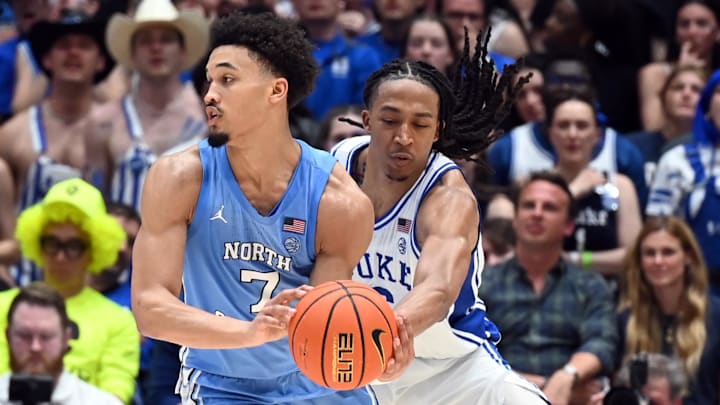 Mar 7, 2026; Durham, North Carolina, USA;Duke Blue Devils forward Maliq Brown (6) pokes the ball away from North Carolina Tar Heels guard Seth Trimble (7) during the second half at Cameron Indoor Stadium. The Duke Blue Devils won 76-61. Mandatory Credit: Rob Kinnan-Imagn Images Mar 7, 2026; Durham, North Carolina, USA;Duke Blue Devils forward Maliq Brown (6) pokes the ball away from North Carolina Tar Heels guard Seth Trimble (7) during the second half at Cameron Indoor Stadium. The Duke Blue Devils won 76-61. Mandatory Credit: Rob Kinnan-Imagn Images