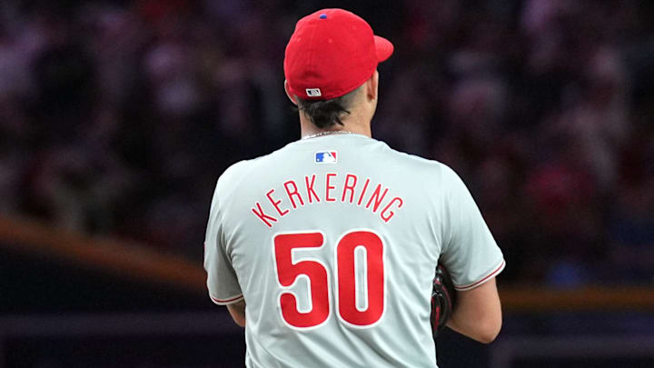 Aug 8, 2024; Phoenix, Arizona, USA; Philadelphia Phillies pitcher Orion Kerkering (50) reacts after giving up a two run home run to Arizona Diamondbacks outfielder Jake McCarthy (31) during the sixth inning at Chase Field