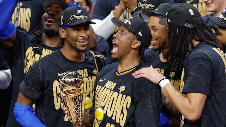Jun 22, 2025; Oklahoma City, Oklahoma, USA; Oklahoma City Thunder forward Jalen Williams (8) holds up the Bill Russell NBA Finals MVP trophy after winner Oklahoma City Thunder guard Shai Gilgeous-Alexander hands it to him at the end of game seven of the 2025 NBA Finals against the Indiana Pacers at Paycom Center. Mandatory Credit: Alonzo Adams-Imagn Images