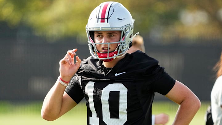 Aug 1, 2024; Columbus, OH, USA; Ohio State Buckeyes quarterback Julian Sayin (10) motions during football camp at the Woody Hayes Athletic Complex. Aug 1, 2024; Columbus, OH, USA; Ohio State Buckeyes quarterback Julian Sayin (10) motions during football camp at the Woody Hayes Athletic Complex.