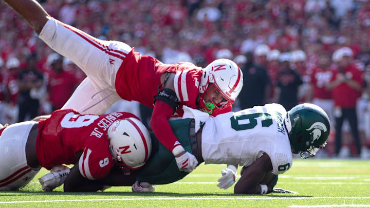 The top vote-getter for Husker Defensive MVP, DeShon Singleton, joins Vincent Shavers (9) in bringing down a Michigan State ball carrier earlier this season.