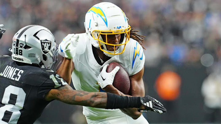 Jan 5, 2025; Paradise, Nevada, USA; Las Vegas Raiders cornerback Jack Jones (18) looks to tackle Los Angeles Chargers wide receiver Quentin Johnston (1) during the second quarter at Allegiant Stadium. Mandatory Credit: Stephen R. Sylvanie-Imagn Images Jan 5, 2025; Paradise, Nevada, USA; Las Vegas Raiders cornerback Jack Jones (18) looks to tackle Los Angeles Chargers wide receiver Quentin Johnston (1) during the second quarter at Allegiant Stadium. Mandatory Credit: Stephen R. Sylvanie-Imagn Images
