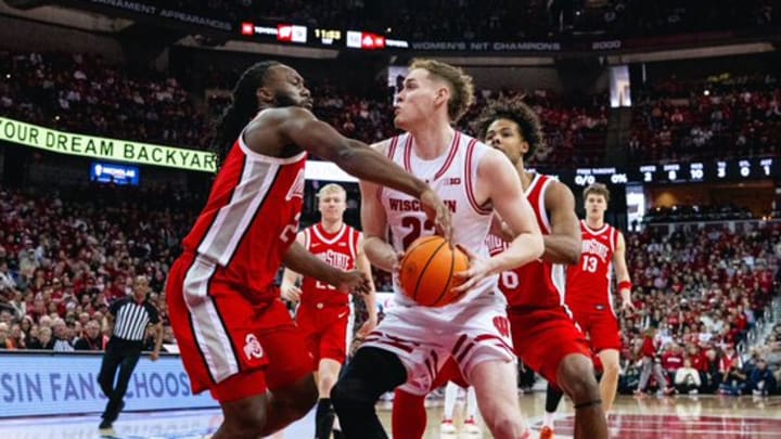 Wisconsin forward Austin Rapp fights for a rebound against Ohio State guard Bruce Thornton.