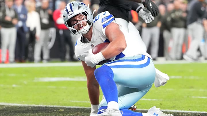 Dallas Cowboys tight end Jake Ferguson scores a touchdown during the first half against the Las Vegas Raiders.