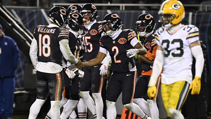 Bears quarterback Caleb Williams and wide receiver DJ Moore  react after the eventual game-winning touchdown in the playoffs against the Packers.