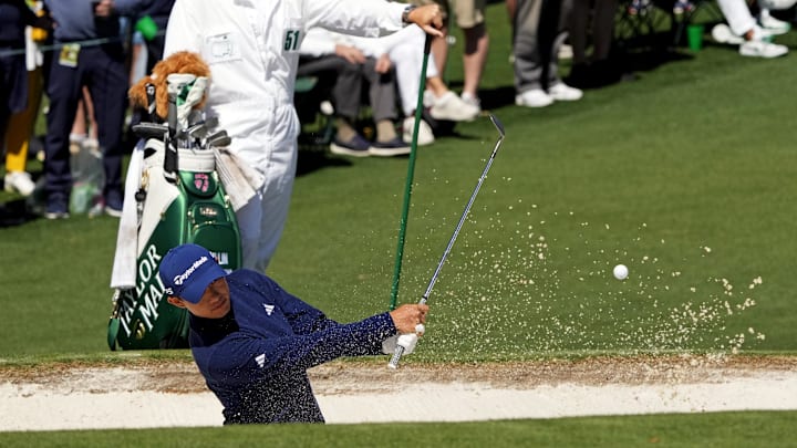 Apr 12, 2024; Augusta, Georgia, USA; Collin Morikawa plays a shot from a bunker on the second hole