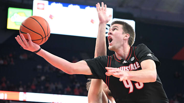 Jan 14, 2025; Syracuse, New York, USA; Louisville Cardinals forward Noah Waterman (93) makes a lay up against the Syracuse Orange in the first half at the JMA Wireless Dome.