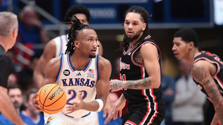 Kansas Jayhawks guard Darryn Peterson (22) looks for an open pass against Houston Cougars during the game inside Allen Fieldhouse on Monday, Feb. 23, 2026.