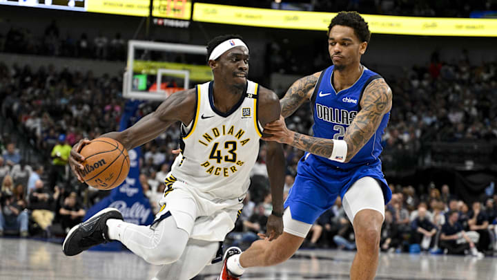 Mar 5, 2024; Dallas, Texas, USA; Indiana Pacers forward Pascal Siakam (43) drives to the basket past Dallas Mavericks forward P.J. Washington (25) during the second half at the American Airlines Center. Mandatory Credit: Jerome Miron-Imagn Images