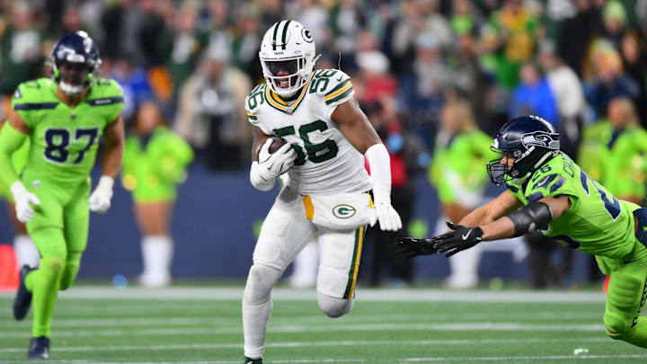 Green Bay Packers linebacker Edgerrin Cooper returns an interception at Seattle.