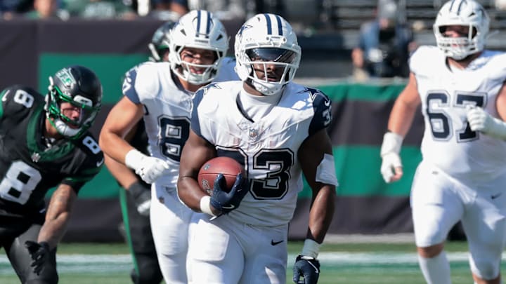 Dallas Cowboys running back Javonte Williams (33) carries the ball against the New York Jets during the first half at MetLife Stadium