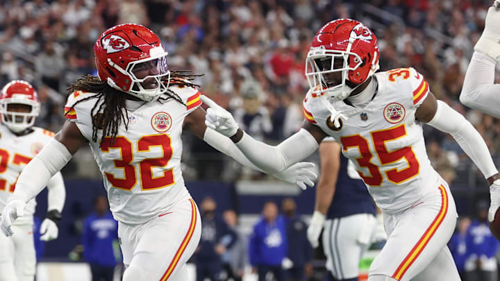 Nov 27, 2025; Arlington, Texas, USA; Kansas City Chiefs linebacker Nick Bolton (32) and Kansas City Chiefs cornerback Jaylen Watson (35) celebrate after an interception against the Dallas Cowboys during the first quarter at AT&T Stadium. Mandatory Credit: Kevin Jairaj-Imagn Images