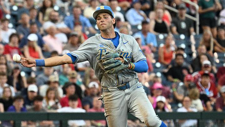 Jun 17, 2025; Omaha, Neb, USA;  UCLA Bruins shortstop Roch Cholowsky (1) throws to first base against the Arkansas Razorbacks during the third inning at Charles Schwab Field. Mandatory Credit: Steven Branscombe-Imagn Images