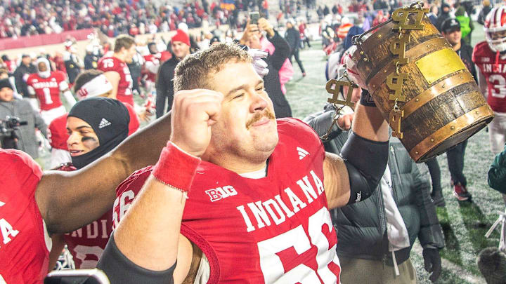 Indiana center Mike Katic (56) celebrates with the Old Oaken Bucket after defeating Purdue 66-0 at Memorial Stadium. Indiana center Mike Katic (56) celebrates with the Old Oaken Bucket after defeating Purdue 66-0 at Memorial Stadium.