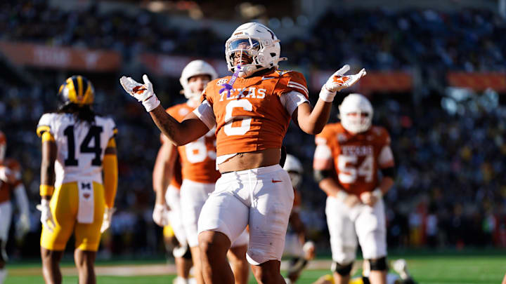 Dec 31, 2025; Orlando, FL, USA; Texas Longhorns running back Christian Clark (6) gestures after scoring a touchdown against the Michigan Wolverines during the first half at Camping World Stadium. Mandatory Credit: Matt Pendleton-Imagn Images Dec 31, 2025; Orlando, FL, USA; Texas Longhorns running back Christian Clark (6) gestures after scoring a touchdown against the Michigan Wolverines during the first half at Camping World Stadium. Mandatory Credit: Matt Pendleton-Imagn Images