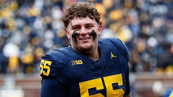 Blue Team defensive lineman Mason Graham (55) walks up the tunnel for halftime during the spring game at Michigan Stadium in Ann Arbor on Saturday, April 20, 2024.