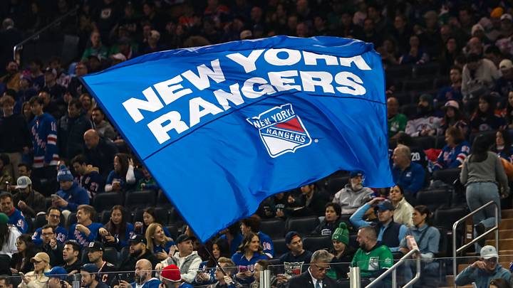 Mar 16, 2025; New York, New York, USA; A New York Rangers flag is seen in the crown during the first period against the Edmonton Oilers at Madison Square Garden. 