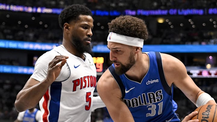 Mar 21, 2025; Dallas, Texas, USA; Dallas Mavericks guard Klay Thompson (31) looks to move the ball past Detroit Pistons guard Malik Beasley (5) during the first half at the American Airlines Center. Mandatory Credit: Jerome Miron-Imagn Images Mar 21, 2025; Dallas, Texas, USA; Dallas Mavericks guard Klay Thompson (31) looks to move the ball past Detroit Pistons guard Malik Beasley (5) during the first half at the American Airlines Center. Mandatory Credit: Jerome Miron-Imagn Images