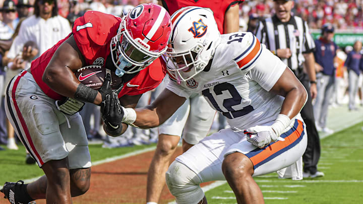 Auburn Tigers linebacker Dorian Mausi Jr. (12). Auburn Tigers linebacker Dorian Mausi Jr. (12).