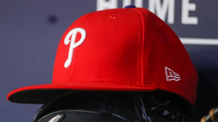 May 26, 2023; Atlanta, Georgia, USA; A detailed view of a Philadelphia Phillies hat and glove on the bench against the Atlanta Braves in the seventh inning at Truist Park. May 26, 2023; Atlanta, Georgia, USA; A detailed view of a Philadelphia Phillies hat and glove on the bench against the Atlanta Braves in the seventh inning at Truist Park.