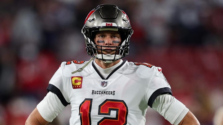 Jan 16, 2023; Tampa, Florida, USA; Tampa Bay Buccaneers quarterback Tom Brady (12) looks on before a  wild card game against the Dallas Cowboys at Raymond James Stadium. Mandatory Credit: Nathan Ray Seebeck-Imagn Images