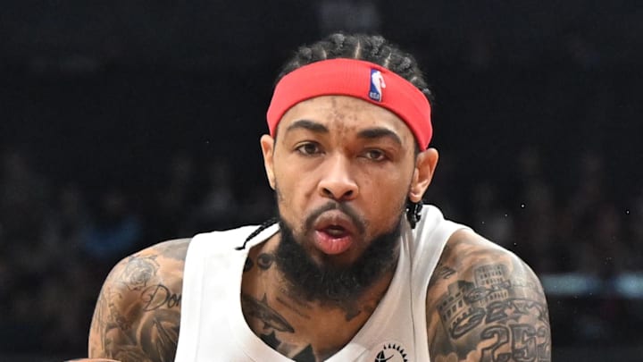 Toronto Raptors forward Brandon Ingram fouls Portland Trail Blazers forward Sidy Cissoko.