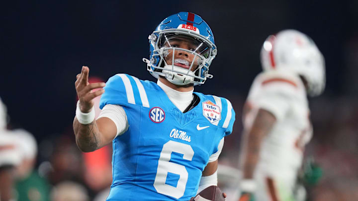 Ole Miss Rebels quarterback Trinidad Chambliss (6) signals a first down after his run against the Miami Hurricanes during their Vrbo Fiesta Bowl matchup at State Farm Stadium on Jan. 8, 2026.