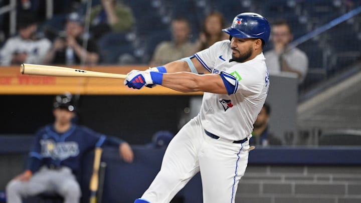 May 14, 2025; Toronto, Ontario, CAN;  Toronto Blue Jays designated hitter Anthony Santander (25) hits a single against the Tampa Bay Rays in the first inning at Rogers Centre. 