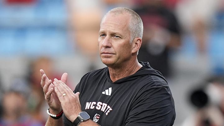 Sep 7, 2024; Charlotte, North Carolina, USA; North Carolina State Wolfpack head coach Dave Doeren during pregame activities against the Tennessee Volunteers at the Dukes Mayo Classic at Bank of America Stadium. Mandatory Credit: Jim Dedmon-Imagn Images Sep 7, 2024; Charlotte, North Carolina, USA; North Carolina State Wolfpack head coach Dave Doeren during pregame activities against the Tennessee Volunteers at the Dukes Mayo Classic at Bank of America Stadium. Mandatory Credit: Jim Dedmon-Imagn Images
