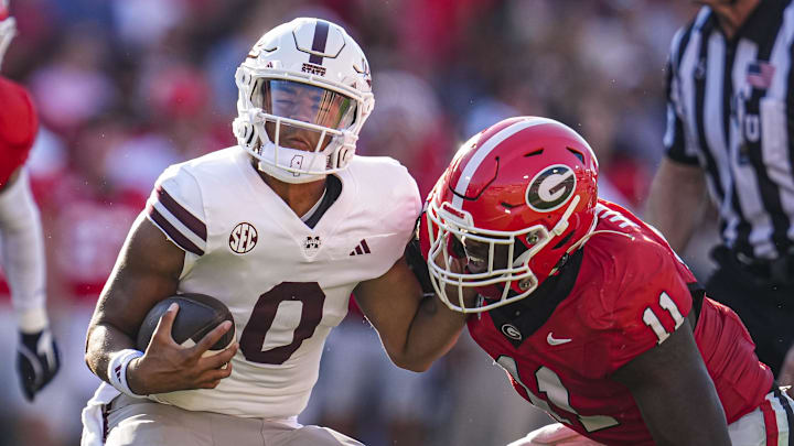 Mississippi State Bulldogs quarterback Michael Van Buren Jr. (0) is tackled by Georgia Bulldogs linebacker Jalon Walker (11) during the first half at Sanford Stadium.
