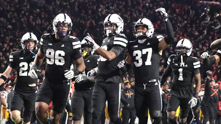 Nebraska players run to the end zone to celebrate Andrew Marshall's interception against USC.