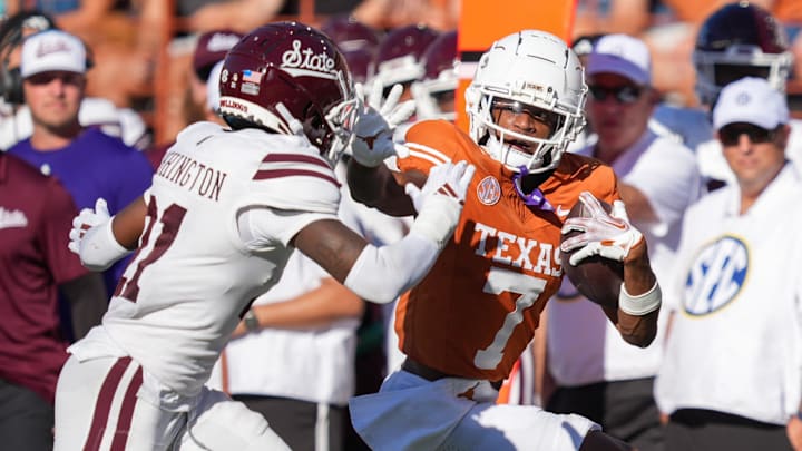 Texas Longhorns wide receiver Isaiah Bond (7) tries to push back Mississippi State Bulldogs safety Hunter Washington (21) in the second half at Darrell K Royal-Texas Memorial Stadium.