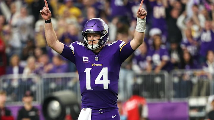 Dec 8, 2024; Minneapolis, Minnesota, USA; Minnesota Vikings quarterback Sam Darnold (14) celebrates running back Aaron Jones' (33) touchdown run against the Atlanta Falcons during the fourth quarter at U.S. Bank Stadium. Mandatory Credit: Matt Krohn-Imagn Images