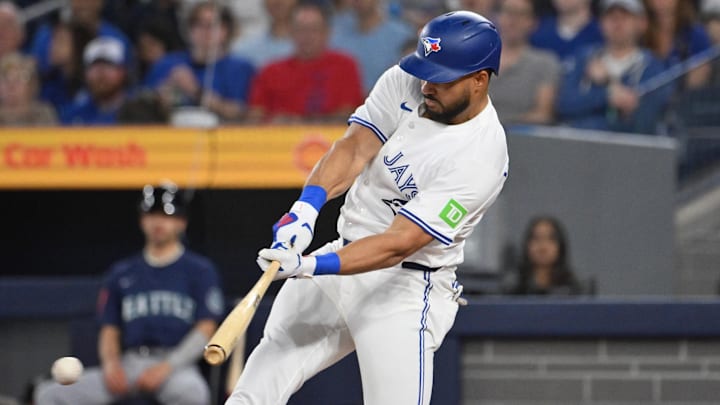 Apr 19, 2025; Toronto, Ontario, CAN;  Toronto Blue Jays right fielder Anthony Santander (25) hits an RBI single against the Seattle Mariners in the first inning at Rogers Centre.