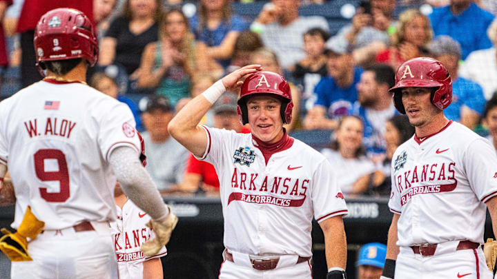 Arkansas Razorbacks Charles Davalan, Logan Maxwell, and Wehiwa Aloy 