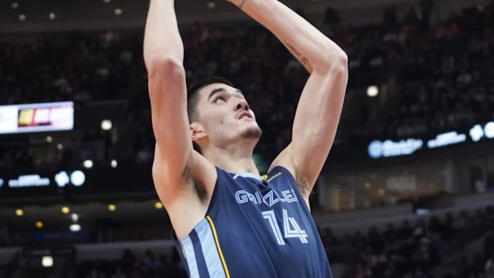 Oct 12, 2024; Chicago, Illinois, USA; Memphis Grizzlies center Zach Edey (14) goes to the basket against the Chicago Bulls during the first half at United Center. Mandatory Credit: David Banks-Imagn Images