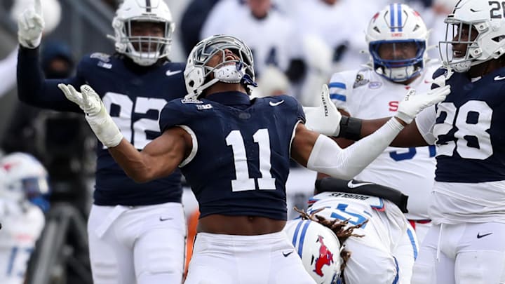Dec 21, 2024; University Park, Pennsylvania, USA; Penn State Nittany Lions defensive end Abdul Carter (11) reacts after sacking Southern Methodist Mustangs quarterback Kevin Jennings (7) during the third quarter in the first round of the College Football Playoff at Beaver Stadium.